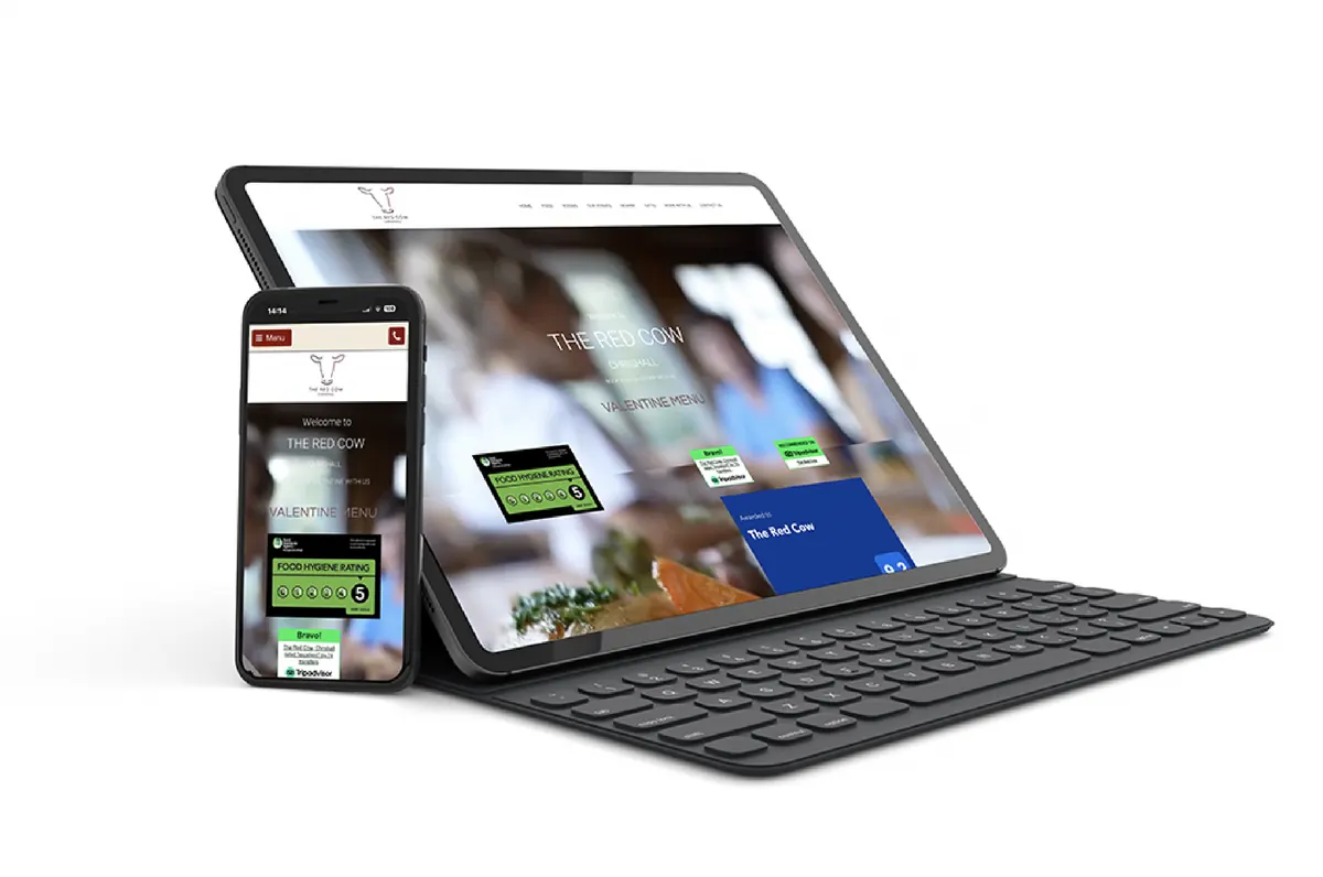 The Red Cow website shown on a tablet and phone
