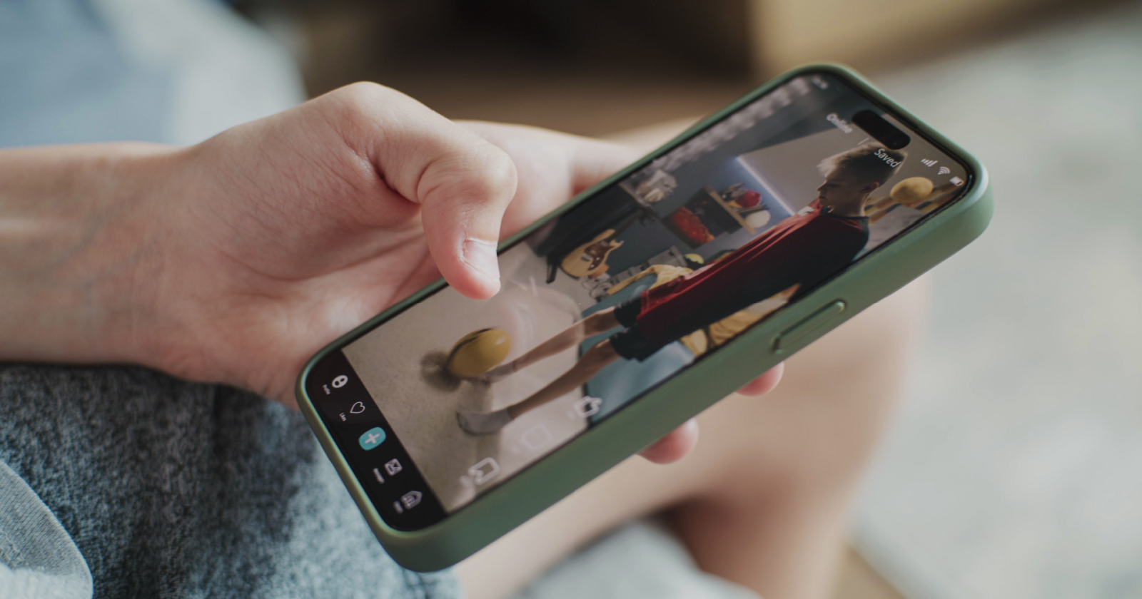 A person scrolling through social media content on a smartphone