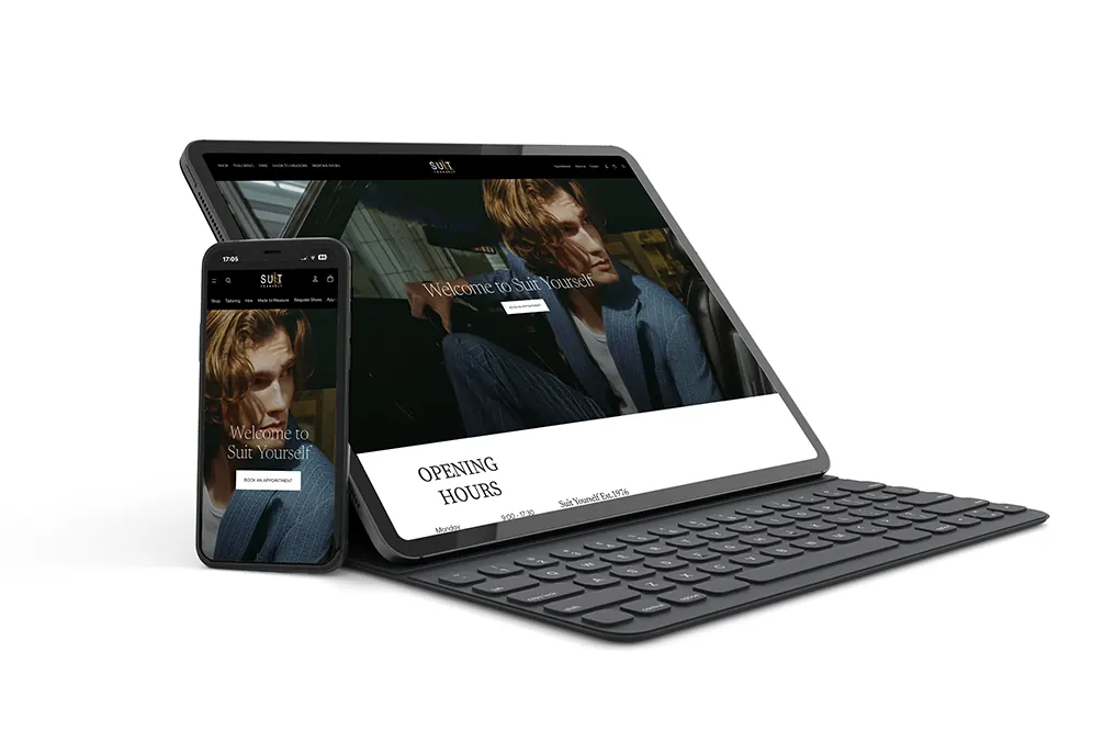 ihjbhjbjhb Suit Yourself website shown on a tablet and phone