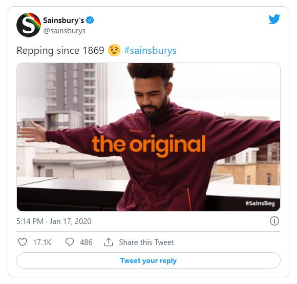 Sainsbury's tweet captioned Repping since 1869, showing a man in an orange Sainsbury's uniform with the words the original